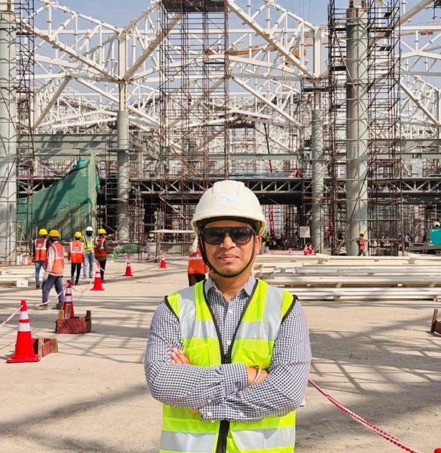 Workers and machinery at Jewar Airport construction site